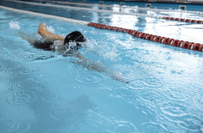 High angle view of man swimming in pool