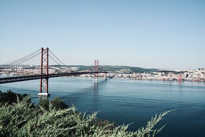 View of the tagus river in lisbon with the bridge of the ponte 25 de abril, lisbon portugal