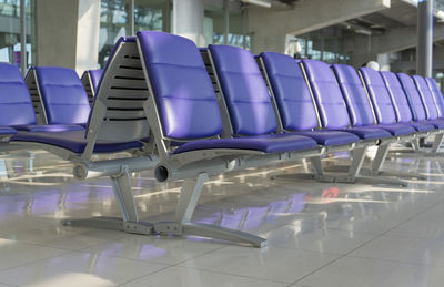 Empty chairs and tables at airport