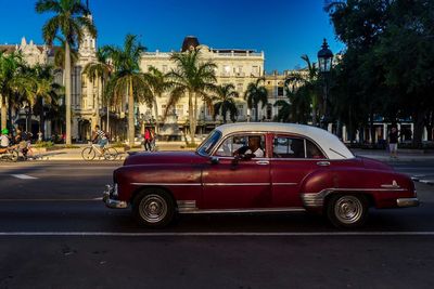 Car on road against blue sky
