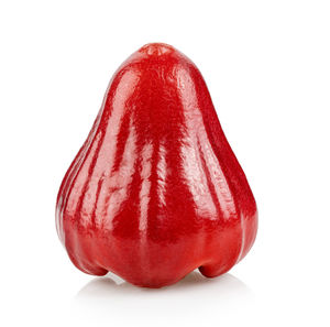 Close-up of red apple against white background