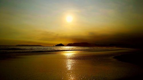 Scenic view of sea against sky at sunset