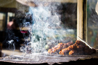 Close-up of meat in cooking pan