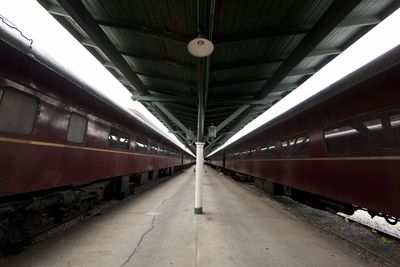 Passenger trains at empty railroad station