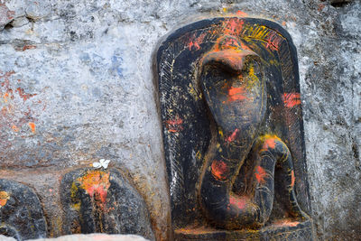 Statue against temple and building