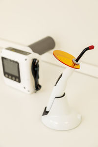 High angle view of camera on table against white background