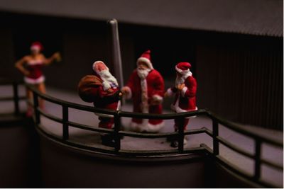 Close-up of santa claus figurines on table