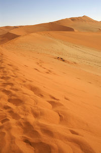 Scenic view of desert against clear sky