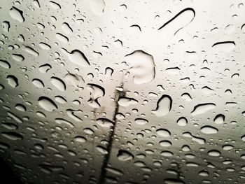 Full frame shot of raindrops on window