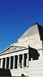 Low angle view of building against blue sky