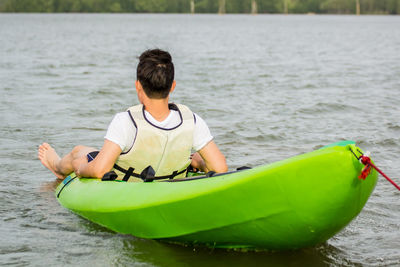 Man kayaking on lake