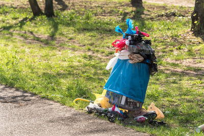 Full length of boy carrying toy on field