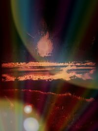 Close-up of rainbow against sky at sunset