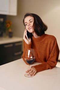 Young woman drinking glass