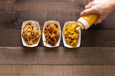Three types of barbecue pulled pork, vinegar, tomato and mustard style
