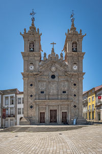 Facade of historic building against clear blue sky