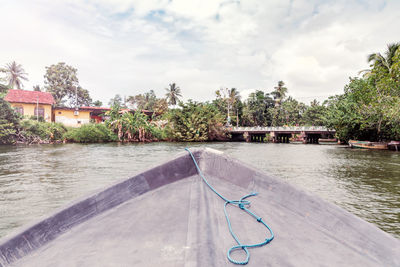 View of swimming pool by river against sky