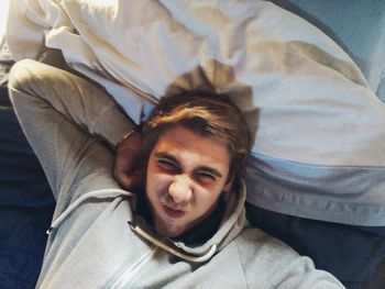 Directly above shot of young man lying on bed