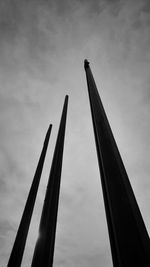 Low angle view of crane against sky