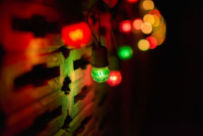 Low angle view of illuminated lights at night