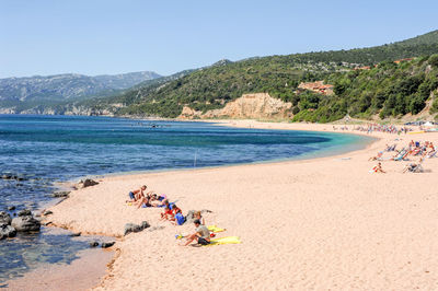 Scenic view of beach against clear sky