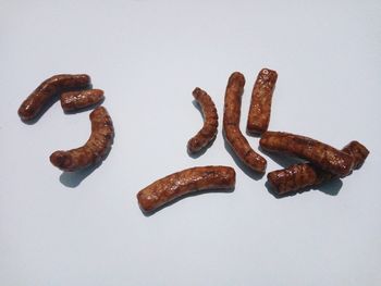 High angle view of bread against white background