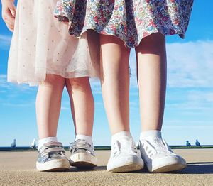 Low section of girl standing outdoors