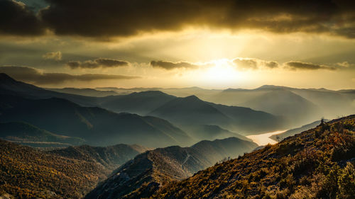 Scenic view of mountains against sky during sunset
