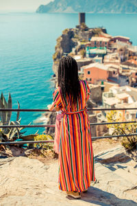 Rear view of woman looking at sea shore