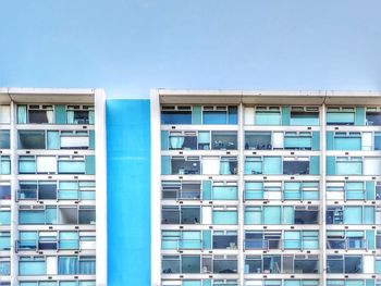 Low angle view of modern building against clear blue sky