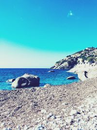 Scenic view of sea against clear blue sky