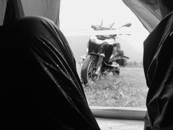 Rear view of people sitting on street in city