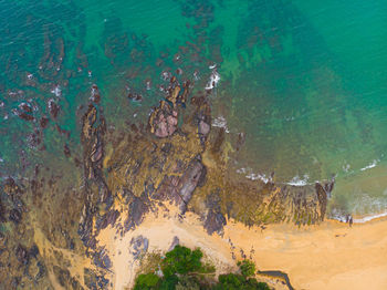 High angle view of rocks in sea