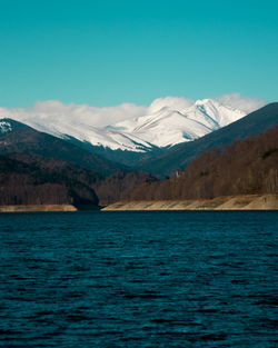 Scenic view of mountains against blue sky