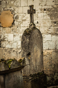 Old stone wall in cemetery