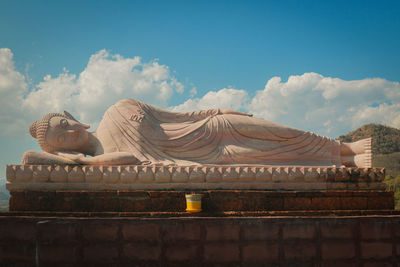 Low angle view of statue against sky