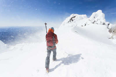 A man climbs down from the summit of mt. hood in oregon.