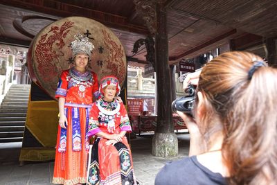 Rear view of women in traditional clothing