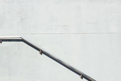 Railing on concrete wall during sunny day