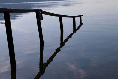 High angle view of wooden posts in lake