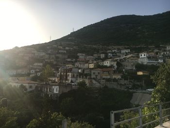 High angle view of townscape and mountains against sky