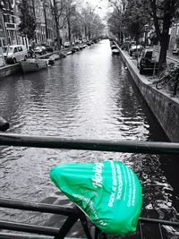 Boats in canal in city