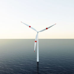 Low angle view of windmill against clear sky