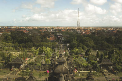 Panoramic view of trees and buildings against sky
