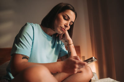 Young woman using mobile phone