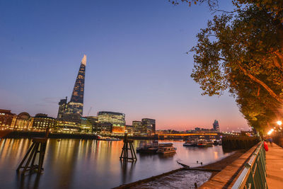 View of illuminated city at sunset