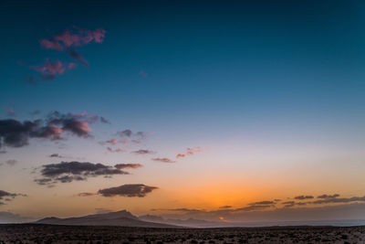 Scenic view of sea against sky at sunset