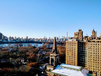 High angle view of buildings against clear sky