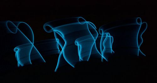 Close-up of blue shoes against black background
