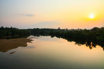 Scenic view of lake against sky during sunset